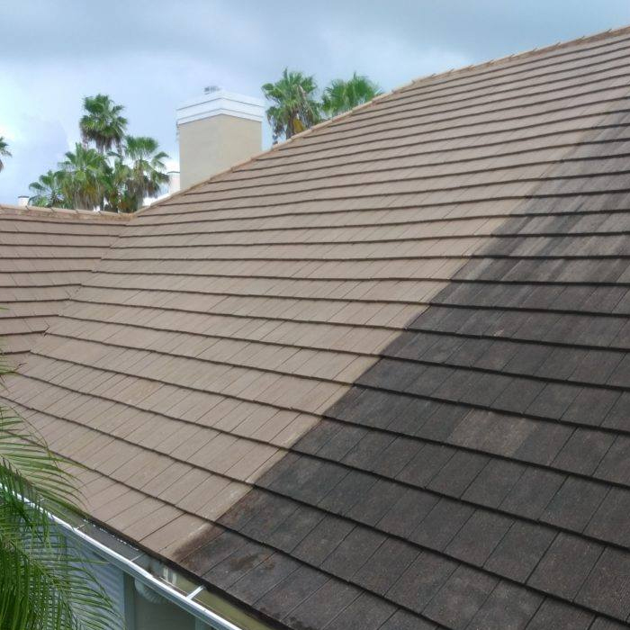 house with asphalt shingles roof softwashing in process fort lauderdale fl